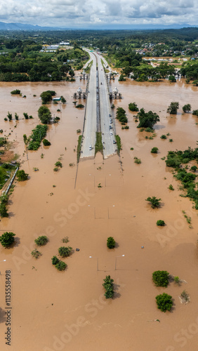 Aerial view of car stuck on the bridge after road flooded during typhoon Yagi has swept Chiang Rai province of Thailand.