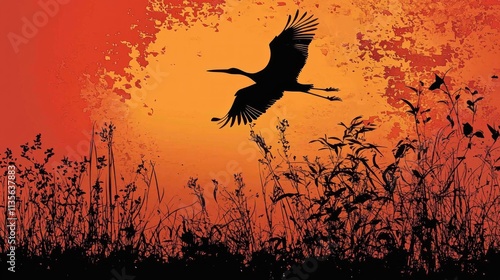 Silhouette of a bird in flight against a fiery sunset