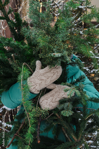 Wallpaper Mural The girl holds an armful of coniferous branches with her hands Torontodigital.ca