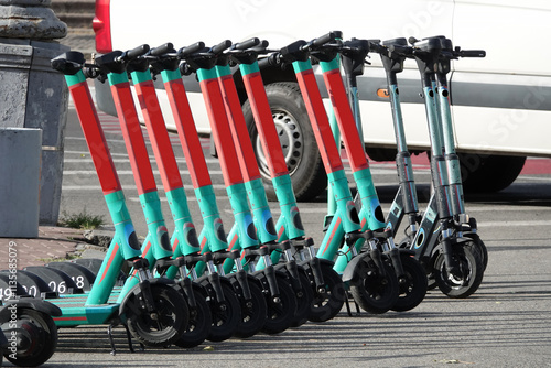 Obraz na płótnie Electric scooters stand in a row w salonie