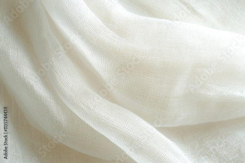 Cream-colored fabric with delicate texture, softly draped. Ideal for backgrounds, fashion, or textile designs, showcasing subtle elegance.