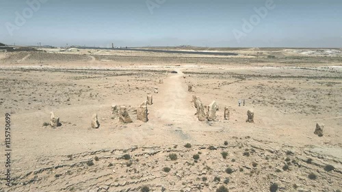 Drone  view of large boulders arranged in the specific pattern at public sculpture park in desert on cliff above Judean Desert near Mitzpe Ramon in southern Israel.