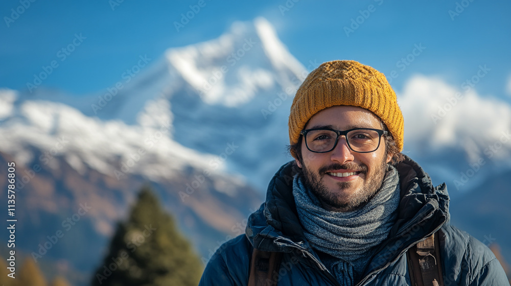 Man smiling in snowy mountain landscape during a bright day near majestic peaks Man smiling in snowy mountain landscape during a bright day near majestic peaks