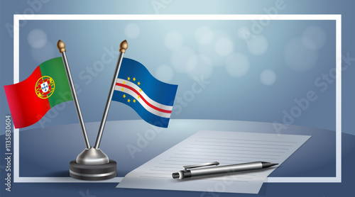 Portugal and Cape Verde National flags on small table with bokeh background, cooperative relationship
