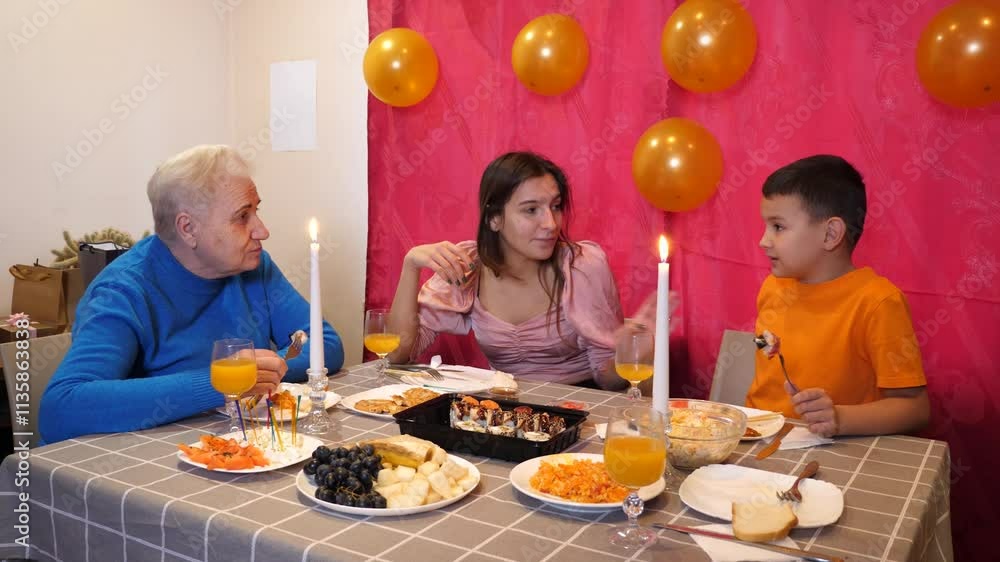 Celebrating a girl's birthday, people sit down at the table, drink drinks and treat themselves. Birthday celebration. Celebrating a girl's birthday, people sit down at the table, drink drinks and treat themselves. Birthday celebration.