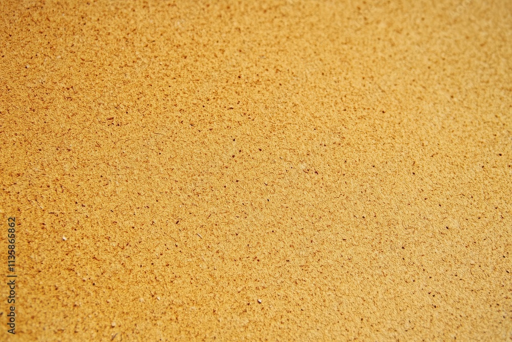 A close-up of old brown recycled cardboard paper, showcasing its texture. A close-up of old brown recycled cardboard paper, showcasing its texture.