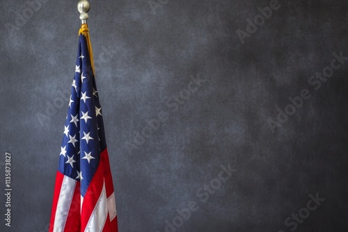 Obraz na płótnie American Flag on Display Against a Dark Gray Background, Symbolizing Patriotism and National Pride, Ideal for Various Editorial and Creative Uses w salonie