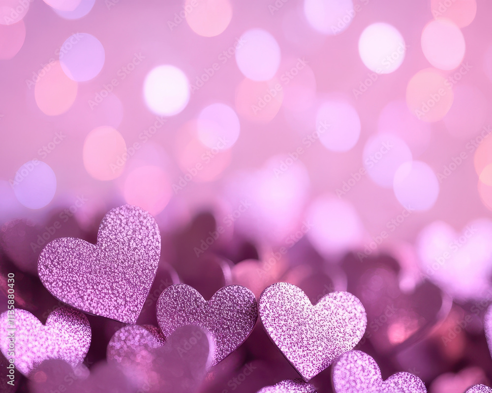 Fototapeta premium Magical purple heart bokeh with sparkling glitter hearts creating dreamy atmosphere. Perfect for romantic themes and celebrations