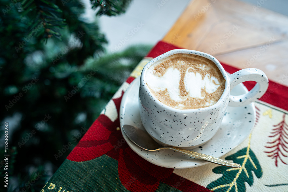 Close up of Hot coffee latte with latte art milk foam in cup mug with Xmas decors and Xmas tree baubles on wood desk Celebrating Merry Christmas and New year,Merry x-mas