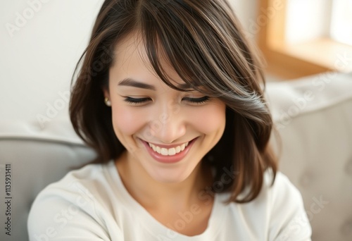 A warm and inviting half-length portrait of a young woman with a gentle smile.