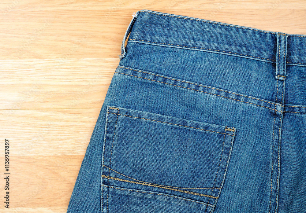 Blue jeans on wooden table background Blue jeans on wooden table background