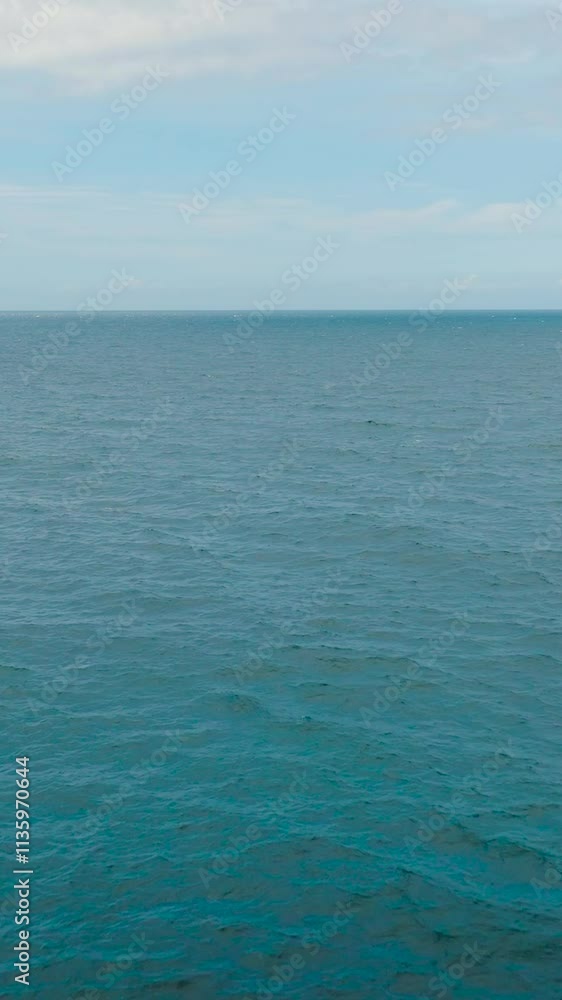 Aerial view of rippled waves on blue sea surface. San Jose. Romblon, Philippines. Vertical view. Aerial view of rippled waves on blue sea surface. San Jose. Romblon, Philippines. Vertical view.