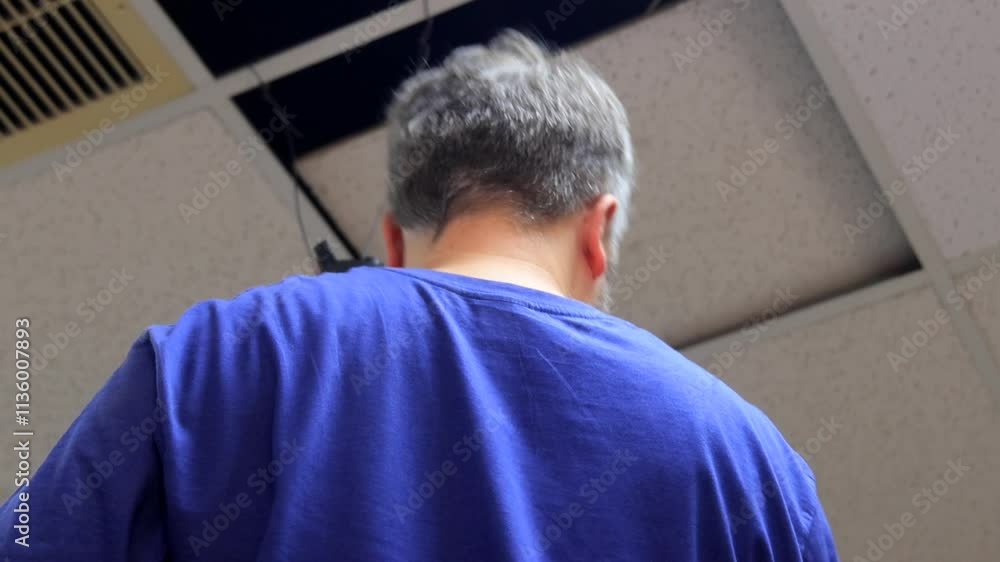 Electrician Installing Overhead Wiring Under Ceiling - Professional Electrical Work and Wiring Installation Process Electrician Installing Overhead Wiring Under Ceiling - Professional Electrical Work and Wiring Installation Process