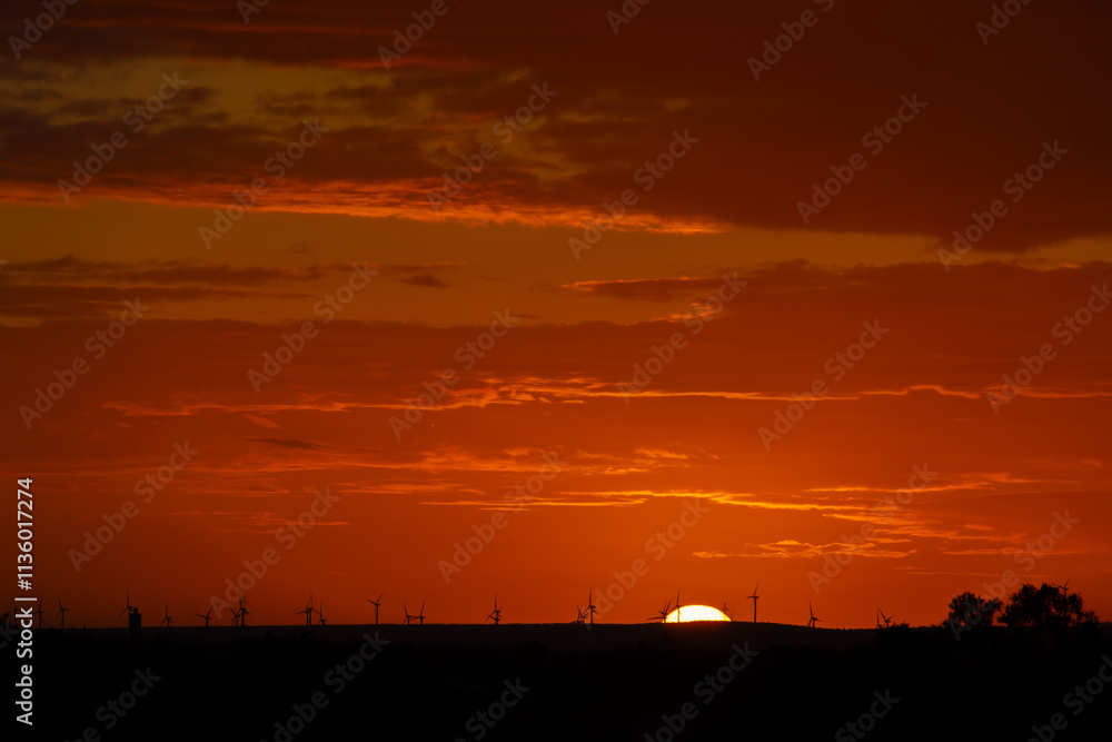 sunset behind the wind turbines in the Essaouira region in Morocco sunset behind the wind turbines in the Essaouira region in Morocco