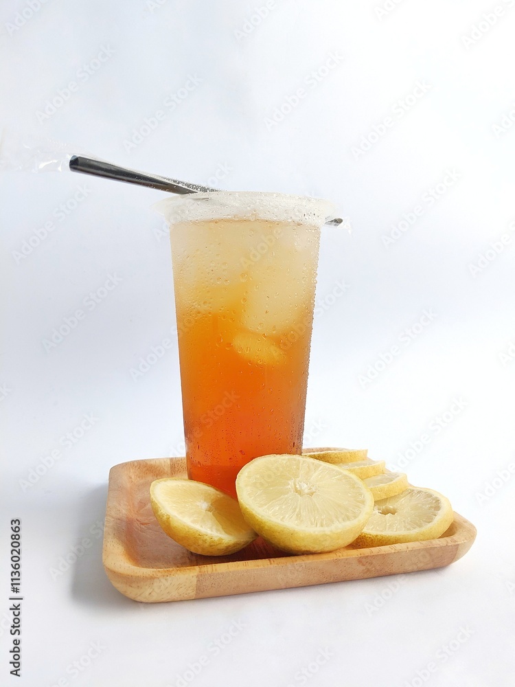Fototapeta premium iced lemon tea packaged in a plastic cup on a white background
