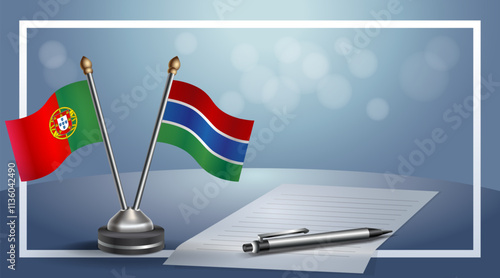 Portugal and Gambia National flags on small table with bokeh background, cooperative relationship