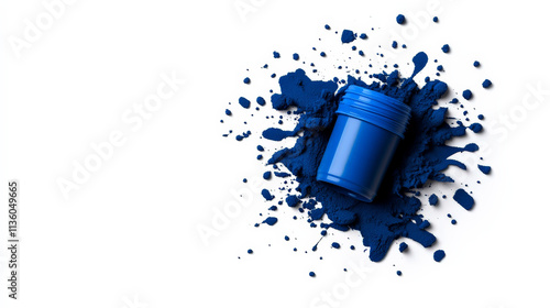 Azure Inspiration: A small jar of vibrant blue paint spills, creating an artistic splash.  Perfect for projects related to creativity, design, and color. photo