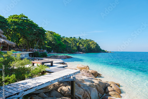 Discover tranquility at Koh Munnork Island amidst pristine waters and lush green surroundings photo