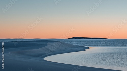 Coastal dunes meet calm sea under a soft, warm dawn sky.