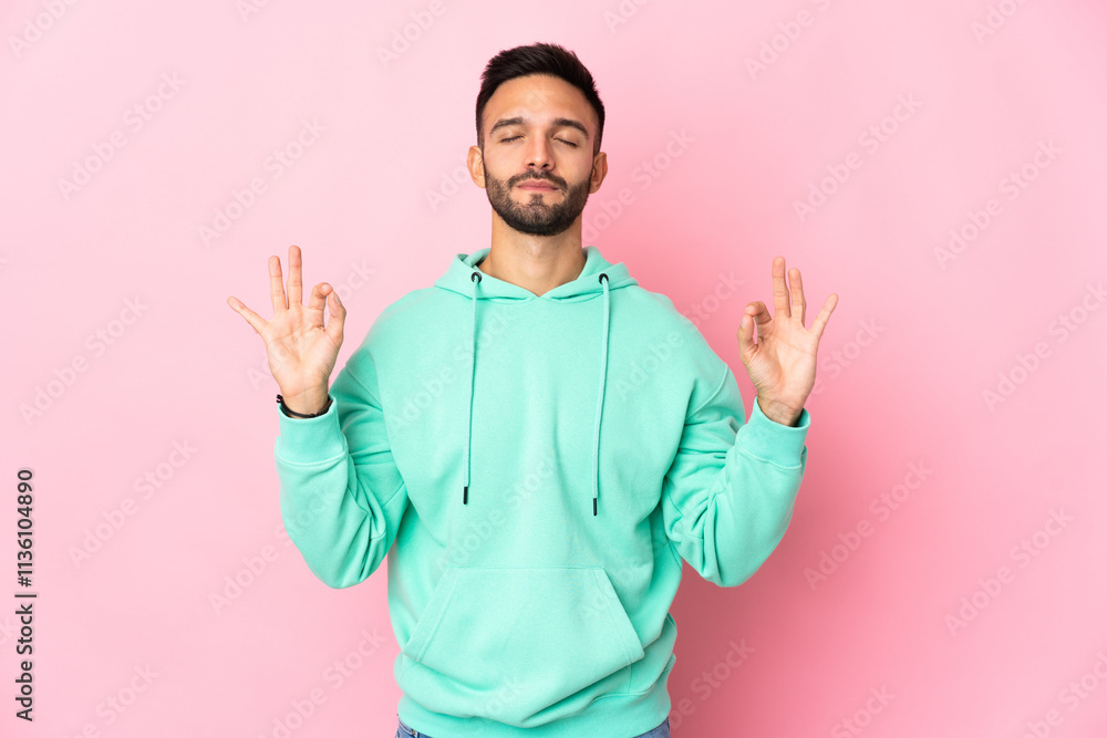 Young caucasian man isolated on pink background in zen pose Young caucasian man isolated on pink background in zen pose