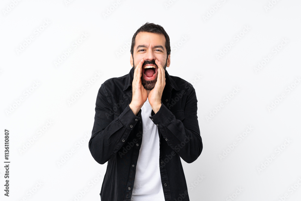 Young man with beard over isolated white background shouting and announcing something Young man with beard over isolated white background shouting and announcing something