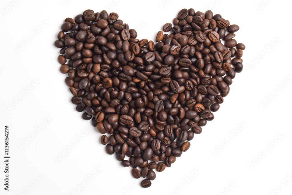 Roasted coffee beans arranged in heart shape isolated on white background. Roasted coffee beans arranged in heart shape isolated on white background.