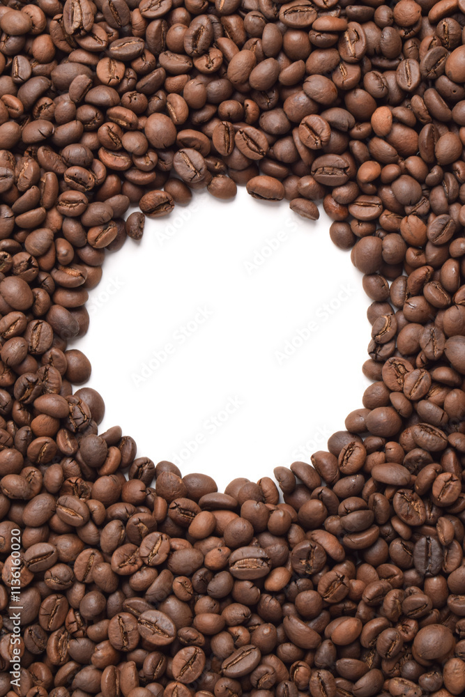 Roasted coffee beans with a circle Frame in the center on a white background. Top view with copy space for your text Roasted coffee beans with a circle Frame in the center on a white background. Top view with copy space for your text