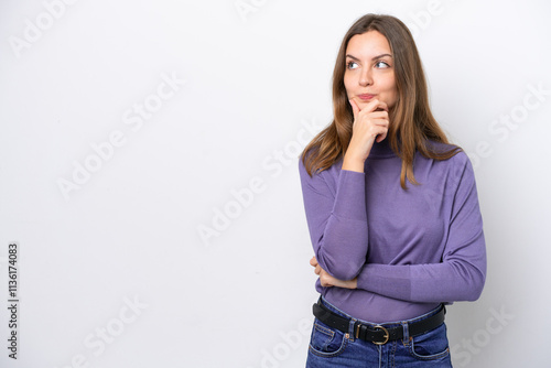 Young caucasian woman isolated on white background thinking an idea while looking up