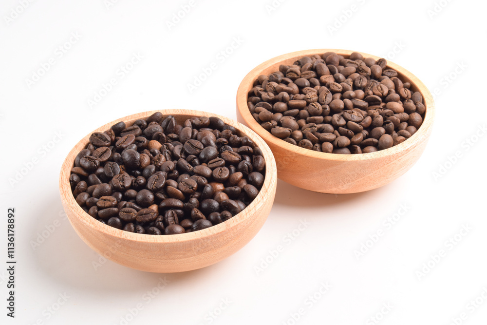 Roasted coffee bean in wooden bowl isolated on white background. Roasted coffee bean in wooden bowl isolated on white background.