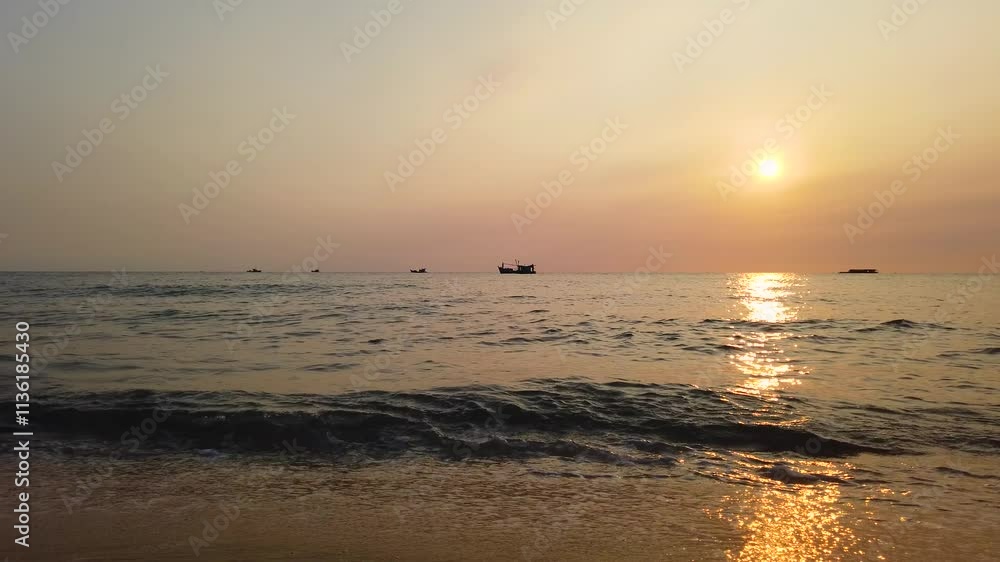 Peaceful seascape with a boat and the setting sun on the horizon Peaceful seascape with a boat and the setting sun on the horizon