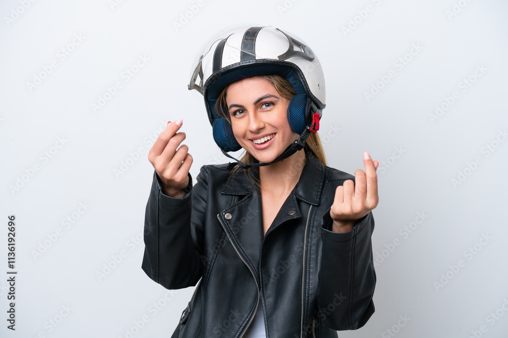 Young caucasian woman with a motorcycle helmet isolated on white background making money gesture Young caucasian woman with a motorcycle helmet isolated on white background making money gesture