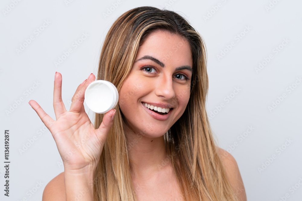 Young caucasian woman isolated on white background with moisturizer and happiness Young caucasian woman isolated on white background with moisturizer and happiness