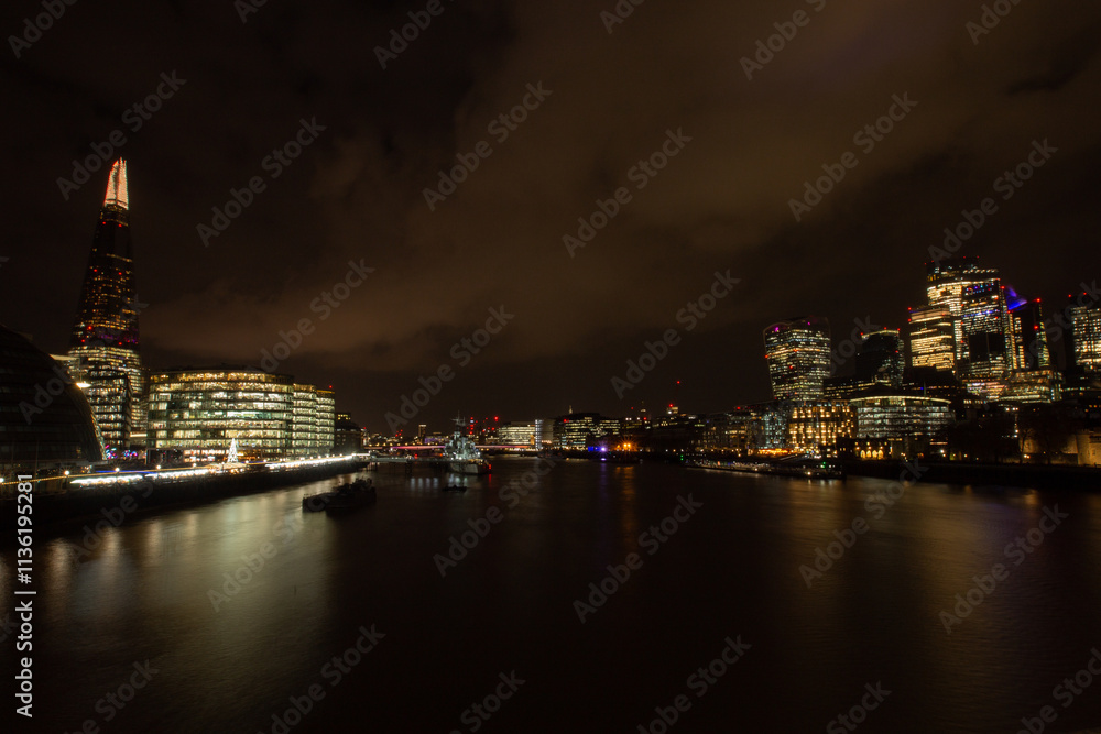The Shard London, famous iconic modern skyscraper, jutting out from the cityscape skyline at night The Shard London, famous iconic modern skyscraper, jutting out from the cityscape skyline at night