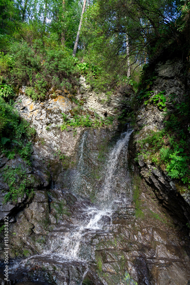 Cheremshansky waterfall. Cheremshanka village, Altai republic, Russia Cheremshansky waterfall. Cheremshanka village, Altai republic, Russia