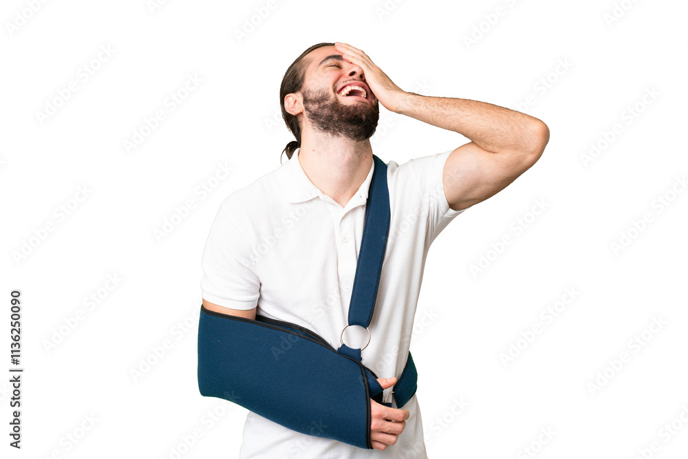 Young handsome man with broken arm and wearing a sling over isolated chroma key background smiling a lot Young handsome man with broken arm and wearing a sling over isolated chroma key background smiling a lot