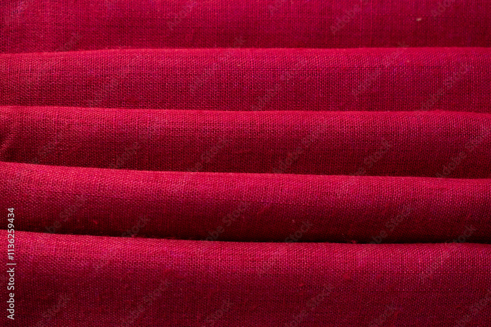 Fototapeta premium Close up Red fabric folded background texture.