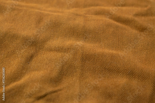Detailed bright brown jeans fabric background texture.