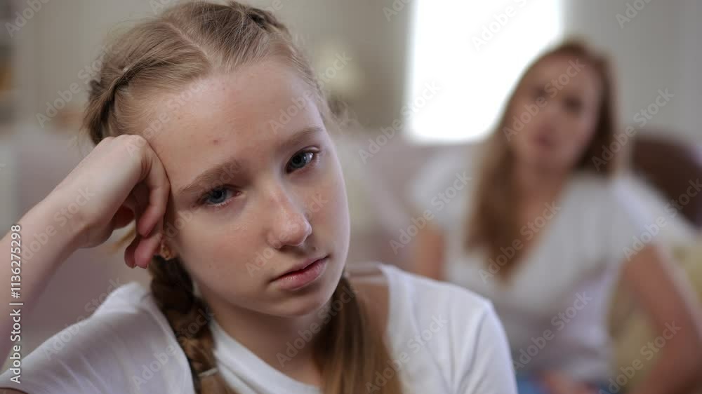 A tense moment captures the deep emotions of a teenager struggling to connect meaningfully with an adult A tense moment captures the deep emotions of a teenager struggling to connect meaningfully with an adult