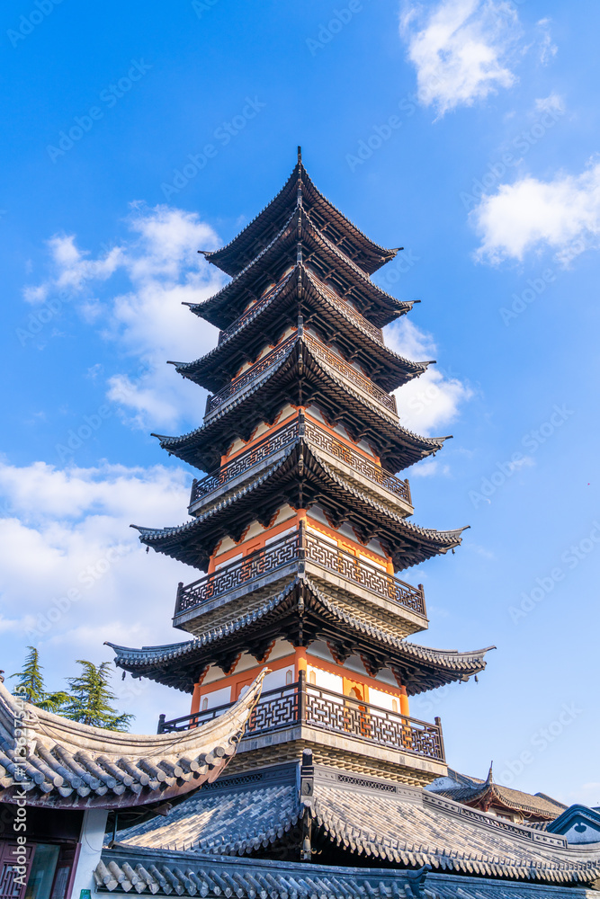Ancient Chinese pagoda under blue sky and white clouds Ancient Chinese pagoda under blue sky and white clouds