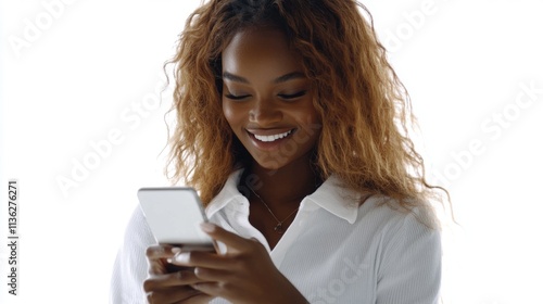 A woman in a light, airy room smiles as she enjoys a moment with her phone, conveying happiness, relaxation, and the easy joy of digital connectivity.