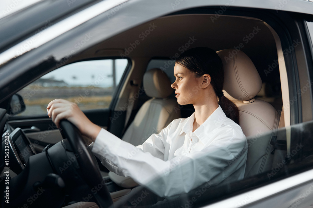 Car, driver, woman, steering wheel a woman sits in the car's driver seat, hands on the steering wheel, and looks directly at the camera, conveying confidence and readiness to drive Car, driver, woman, steering wheel a woman sits in the car's driver seat, hands on the steering wheel, and looks directly at the camera, conveying confidence and readiness to drive
