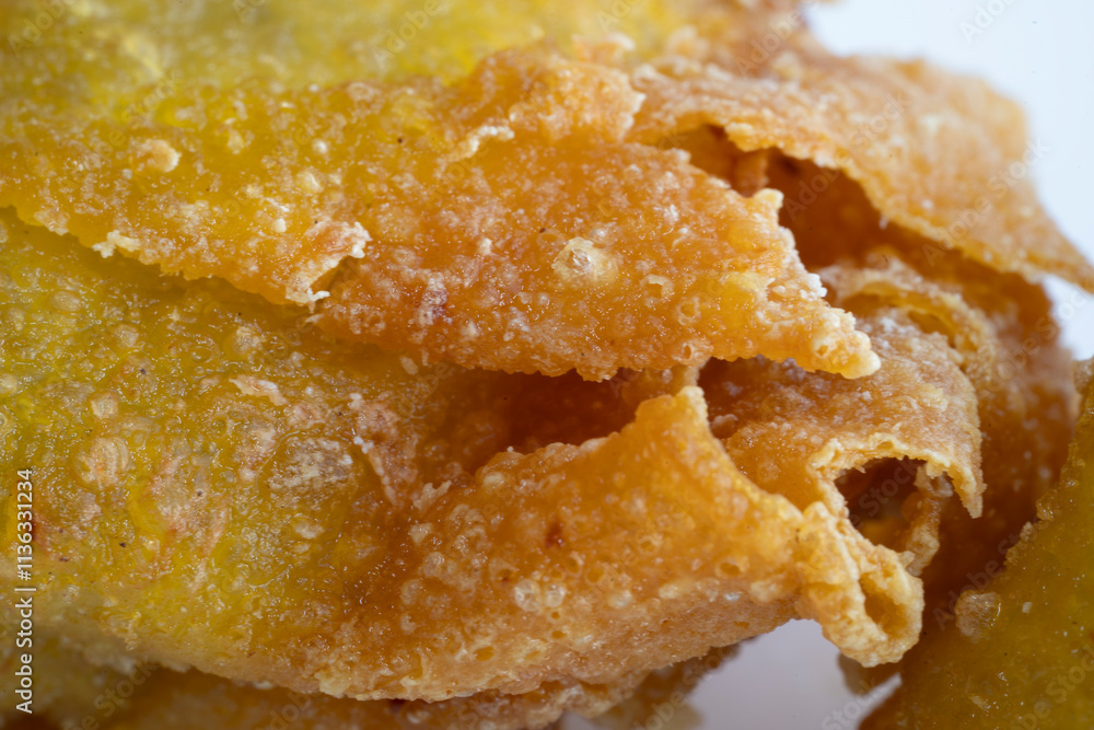 CLose-up view of chine food wanton fried ina white color plate with stick on it CLose-up view of chine food wanton fried ina white color plate with stick on it