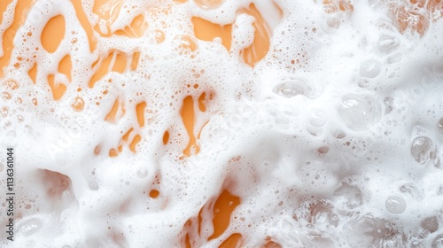 A textured close-up highlights creamy liquid sporting playful frothy bubbles, showcasing a sense of culinary art and creativity in an irresistibly modern image. photo