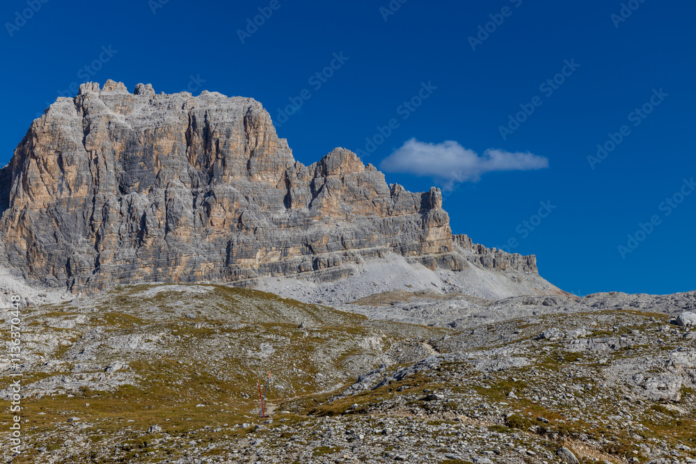 Fototapeta premium Autumn mountains. Alps in autumn colors. Dolomites beautiful yellow tree leaves autumn landscape. Alpine scenery of golden autumn