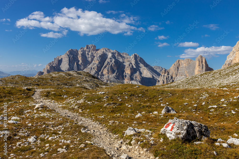 Fototapeta premium Autumn mountains. Alps in autumn colors. Dolomites beautiful yellow tree leaves autumn landscape. Alpine scenery of golden autumn