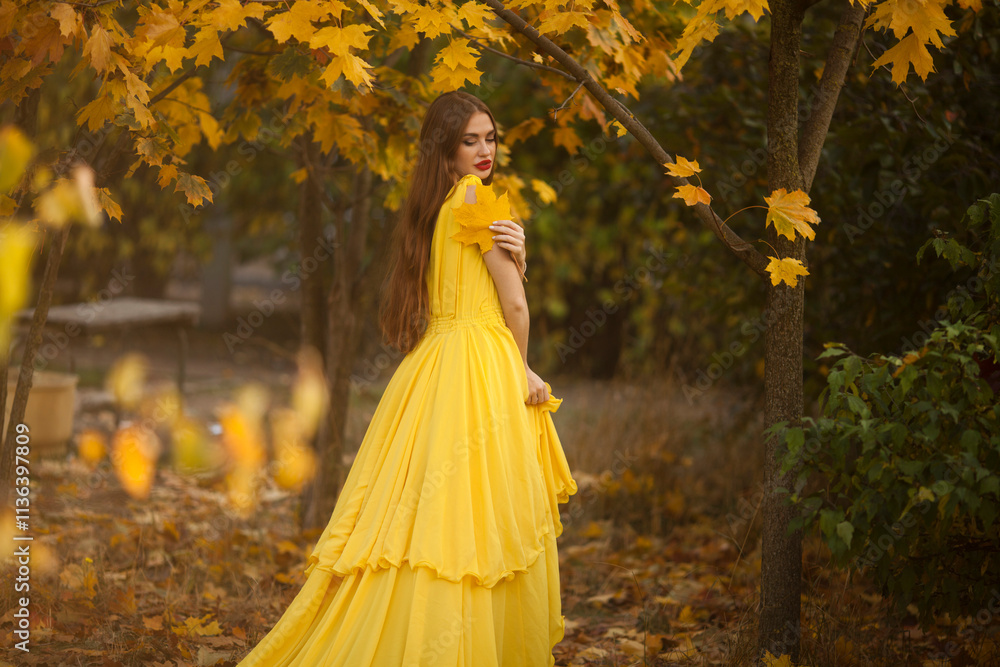 Young princess walking in a beautiful yellow dress.
