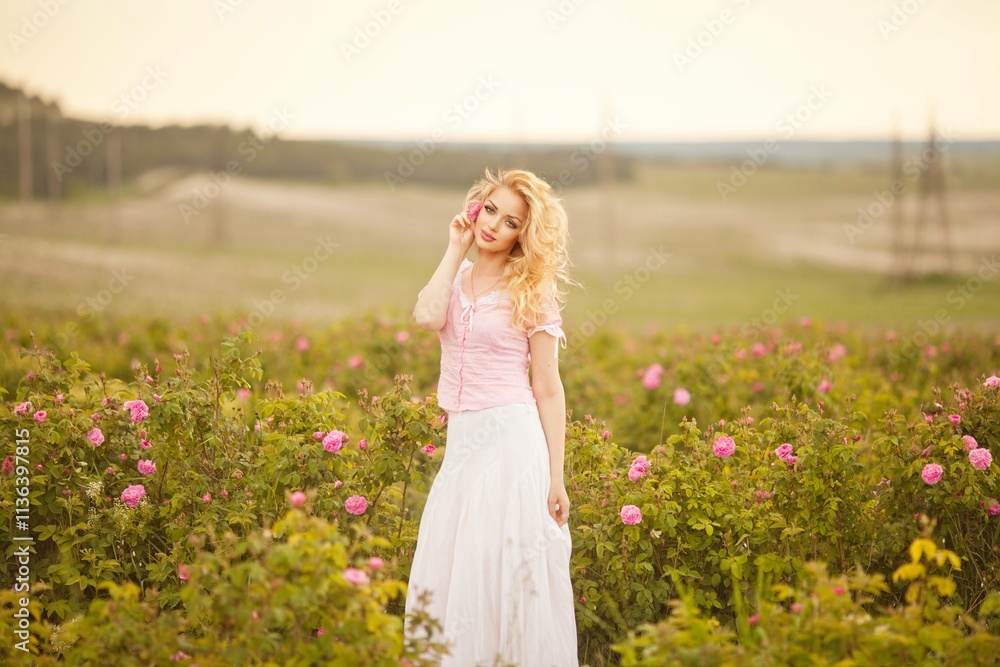 Spring Woman in Rose Field.