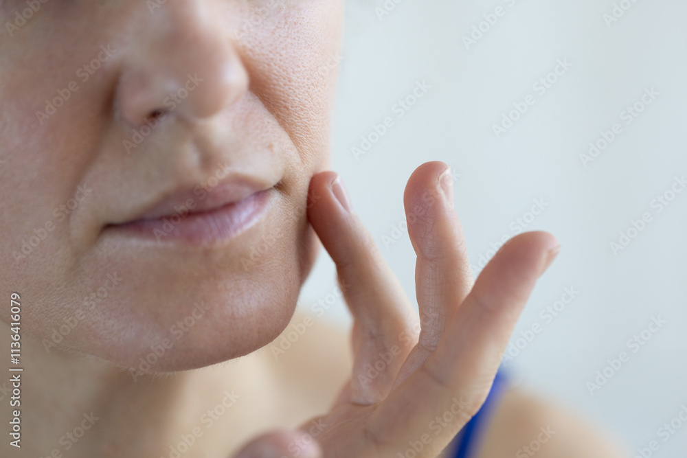 Obraz premium Woman with problem skin. Big pores, facial hair and wrinkles on the face. Closeup.