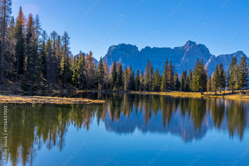 Autumn mountains. Alps in autumn colors. Dolomites beautiful yellow tree leaves autumn landscape. Alpine scenery of golden autumn Autumn mountains. Alps in autumn colors. Dolomites beautiful yellow tree leaves autumn landscape. Alpine scenery of golden autumn