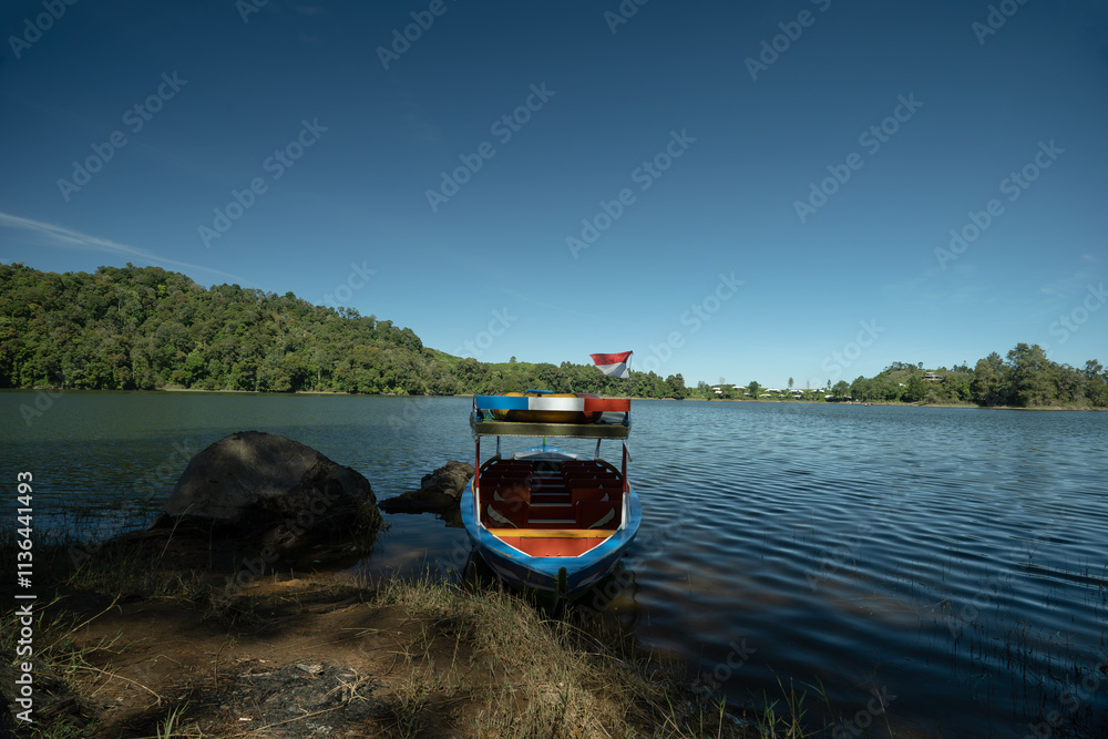 Naklejka premium Patenggang Lake Bandung, with Traditional boat on the Foreground